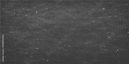 A blank black chalkboard with subtle traces of chalk dust and texture creates a simple yet captivating backdrop for educational themes, adding a touch of rustic charm.