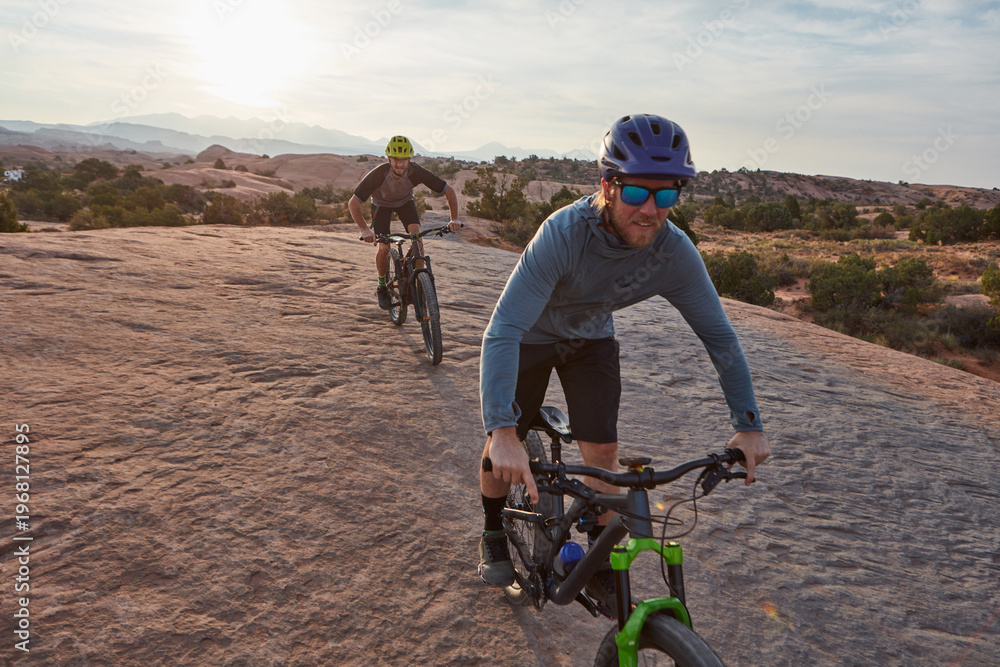 Fototapeta premium People, sports and cycling in nature with mountain bike, adventure or workout together for fitness. Active, friends and countryside journey with bicycle, rock terrain or cardio exercise for wellness.