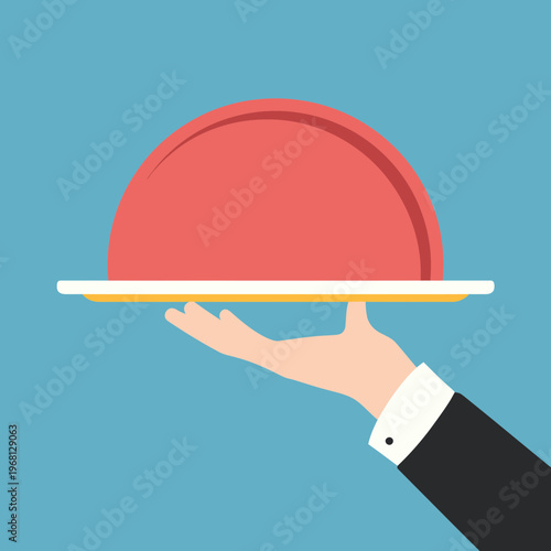 Waiter presenting a covered food dish