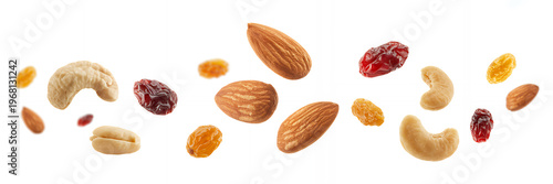 Mixed nuts and dried fruits scattered on white cashews almonds raisins