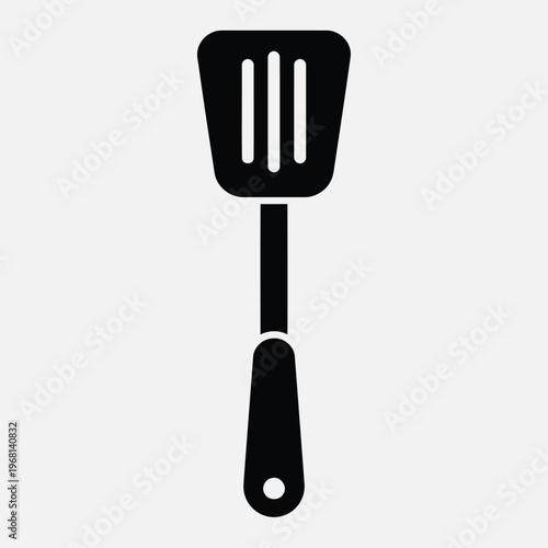 Black silhouette icon of a kitchen spatula with slots on a vector
