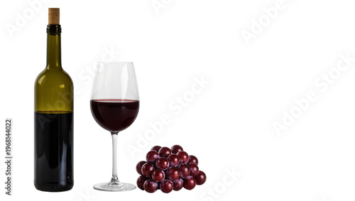 Фотография Dark red wine in a clear glass goblet next to a bottle and grapes, isolated on t