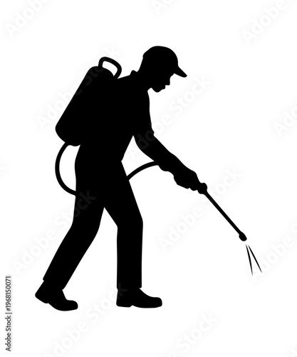 Exterminator worker spraying pesticide for pest control service