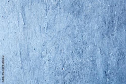 Foto Blue painted concrete wall texture with visible brush strokes and drips