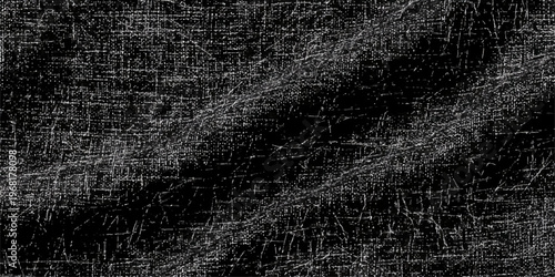 A dark grunge texture backdrop featuring a vintage binary code abstract pattern on a rough black surface for a textured wallpaper design