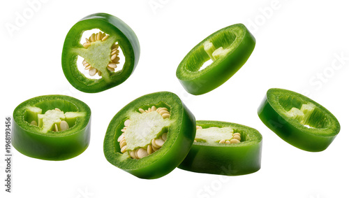 Photos Several vibrant green jalapeño pepper slices showcasing their spicy seeds and ju