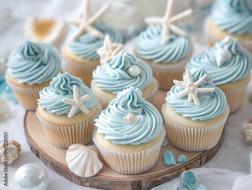 A collection of birthday cupcakes inspired by the ocean, each topped with smooth buttercream frosting in shades of blue, aqua, and sandy beige, creating a serene beach vibe.
