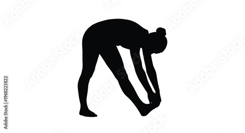 Woman performing a forward bend yoga pose striking black silhouette