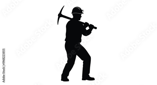 Miner carrying a pickaxe and lamp a striking black silhouette