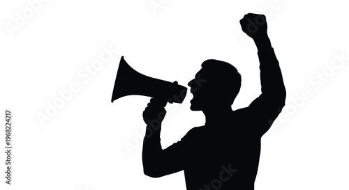 Man speaking into a megaphone with a raised fist a stark silhouette