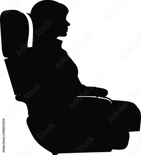 Silhouette of a person sitting in a first-class airplane seat with armrests and headrest