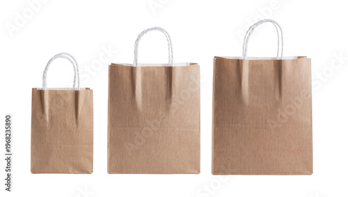 Three brown paper shopping bags of varying sizes, neatly arranged and isolated on transparent background for retail marketing and packaging designs