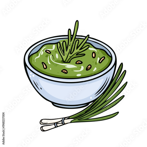 Fresh green pesto sauce in a bowl with chives and herbs