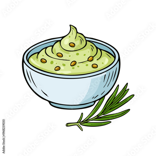 Creamy green pesto dip in bowl with pine nuts and rosemary herb sprig side view