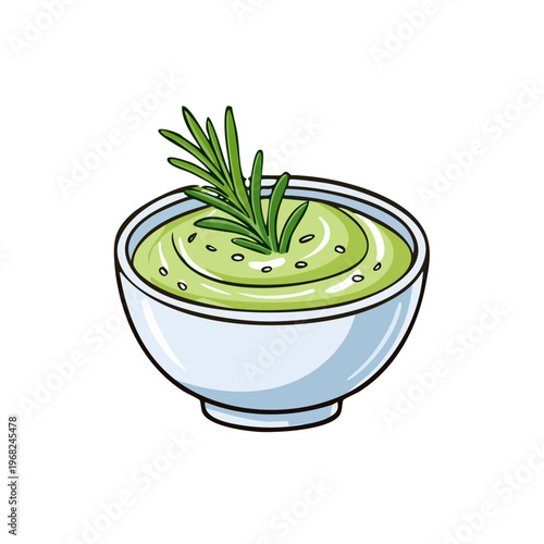 Fresh green herbal dip in a white ceramic bowl with rosemary sprig garnish