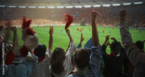 Back View of Diverse Football Fans Celebrating in a Packed Stadium, Raising hands, Clapping and Waving Scarves During a Professional International Championship Match and Cup Tournament. Slow Motion