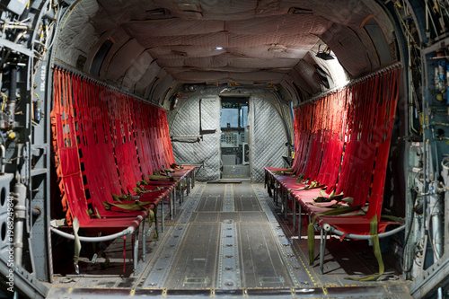 Wallpaper Mural Interior of a vintage military transport helicopter showing red seats Torontodigital.ca