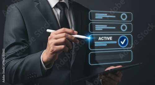 A businessman in a suit interacts with a futuristic digital interface on a tablet