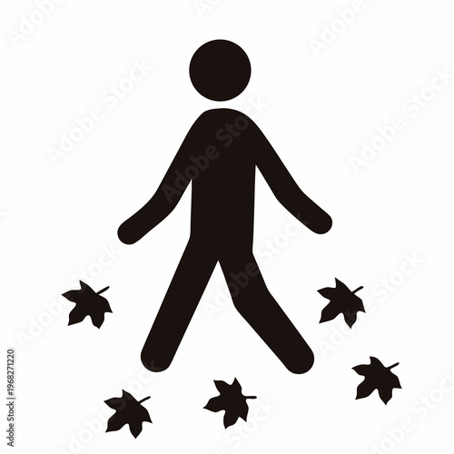 Silhouette of person walking amidst falling leaves, symbolizing autumn strolls and transition