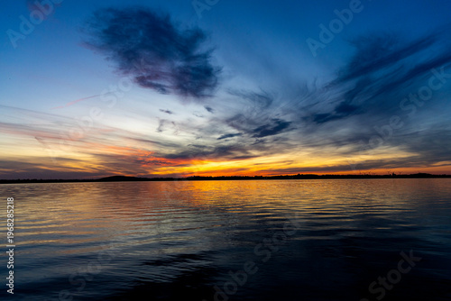Colorful sunset over the lake. Mietkowski Lake, Poland
