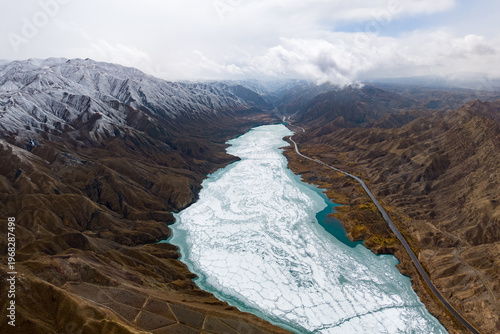 Cuadro en lienzo Aerial view of a frozen river flowing through the Qilian Mountains in China with