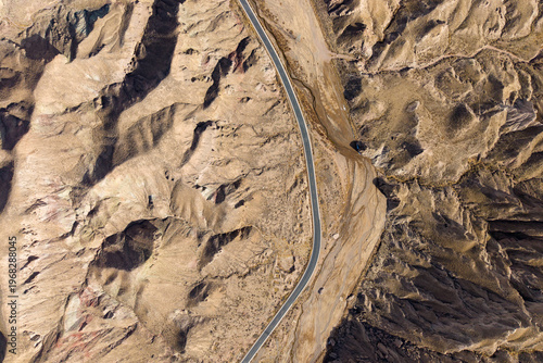 Cuadro en lienzo Aerial view of a road winding through the colorful Danxia landform mountains in