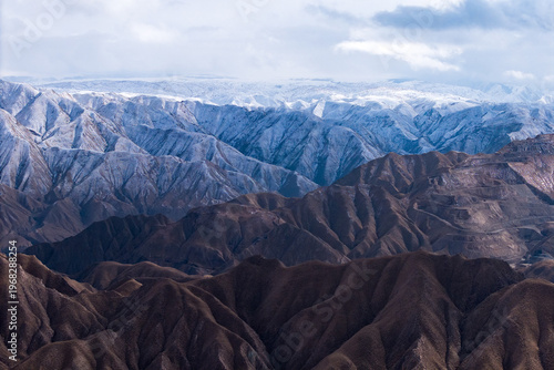 Konstfotografi Snow covered Qilian Mountains featuring dramatic Danxia landforms in China