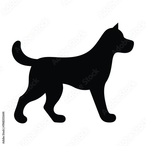 A sleek black silhouette of a dog standing tall and looking forward
