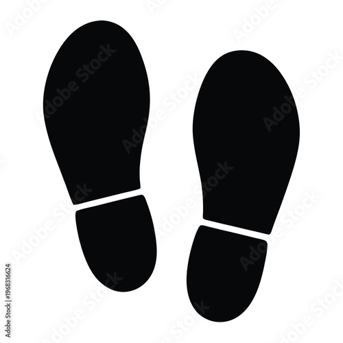 Black and white image showing the imprints or footprints of human shoes