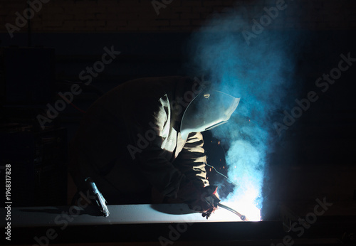 Photography Welder at work. Welding of metal structure.