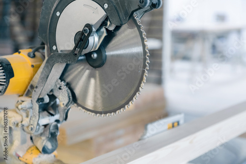 Circular saw in production. Large disc with sharp teeth.