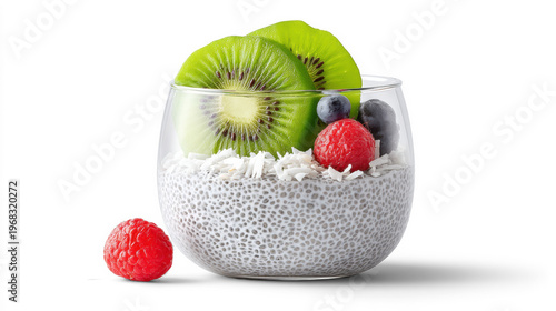 Chia seed pudding in glass bowl topped with kiwi slices blueberries raspberries and coconut flakes
