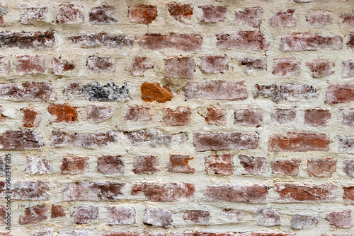Obraz na plátne Old weathered red brick wall with concrete mortar joints providing a rustic background pattern