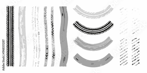 Collection of various tire track and brushstroke impressions on white