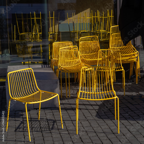 Yellow cafe chairs stacked up