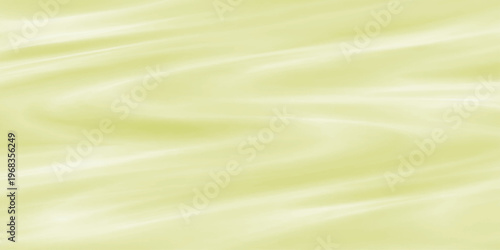 An abstract golden silk fabric background with smooth flowing waves and soft yellow lines creates a decorative satin texture design for an artistic wallpaper backdrop