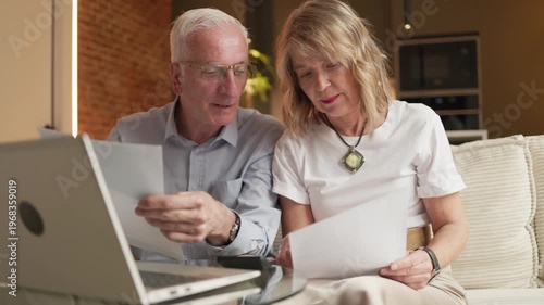 Senior couple analyzing retirement savings and financial budget