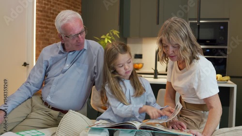 Grandparents teaching girl drawing at home activity