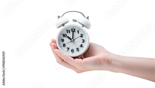 Foto Pale vintage twin-bell alarm clock with black hands showing 2 15 gently held by