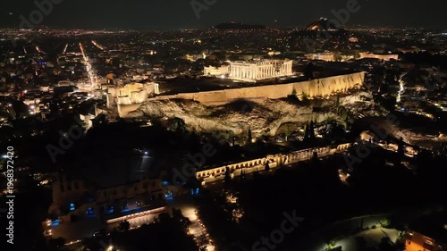 Aerial drone cinematic night video of iconic Acropolis hill and the Parthenon, Athens historic centre, Attica, Greece