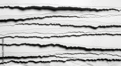 Torn paper background with ripped edges, black and white texture