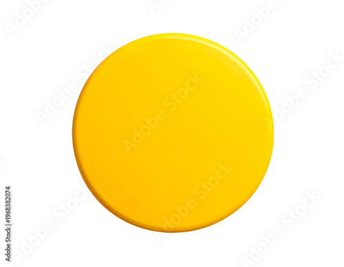 A smooth, shiny, yellow disc casts a subtle shadow