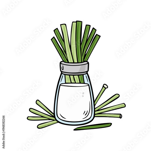 Glass bottle filled with liquid and fresh lemongrass stalks surrounded by more stalks