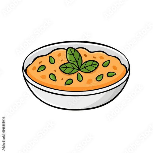 Delicious bowl of creamy orange soup garnished with fresh green mint leaves and seeds