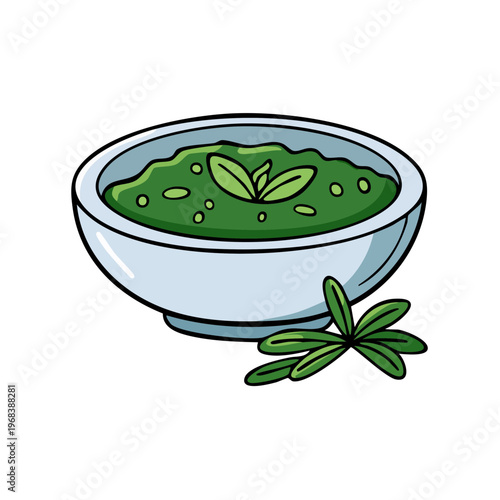 Fresh green herbal pesto sauce in a bowl with rosemary sprigs garnish