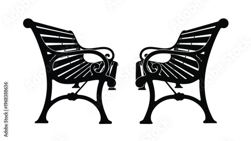 Two ornate park benches facing each other a striking silhouette