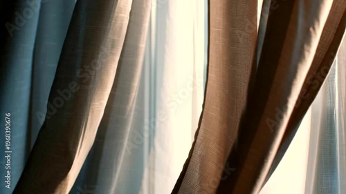 Elegant beige curtains gently sway, illuminated by the delicate morning light, casting soft shadows that evoke a peaceful and cozy home environment, symbolizing comfort and the start of a tranquil day