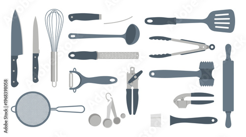 A comprehensive collection of essential kitchen utensils and cooking tools is neatly arranged in a flat lay composition, featuring a modern and muted blue-grey color palette.