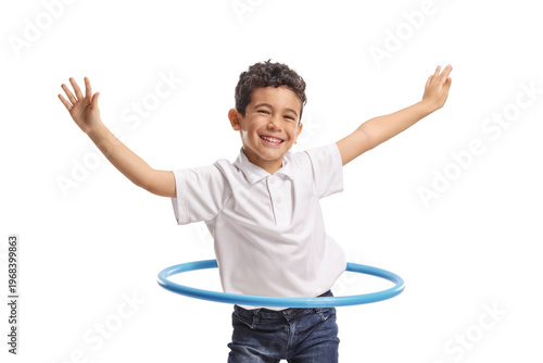 Cute little boy spinning a hula hoop