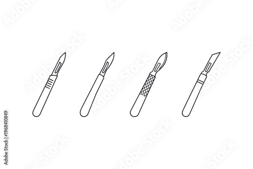 Collection of four different surgical scalpels with sharp blades and handles